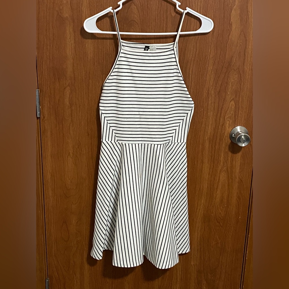 Sleeveless black & white striped skater dress.